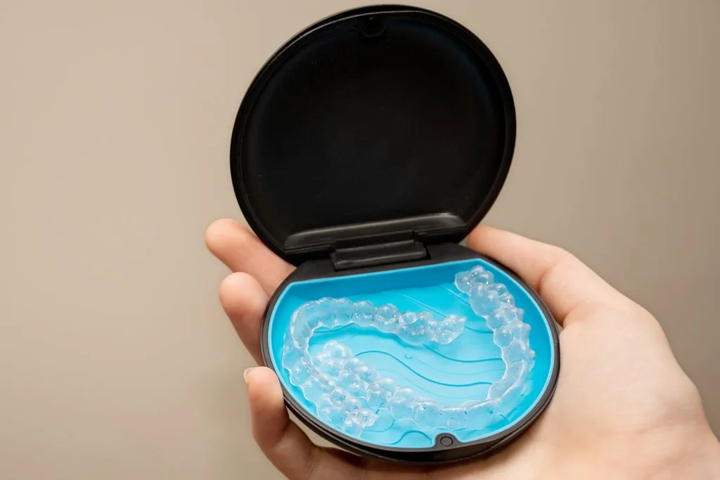 Transparent aligners and storage case box. Invisible braces. Clear teeth straighteners. Plastic bracers