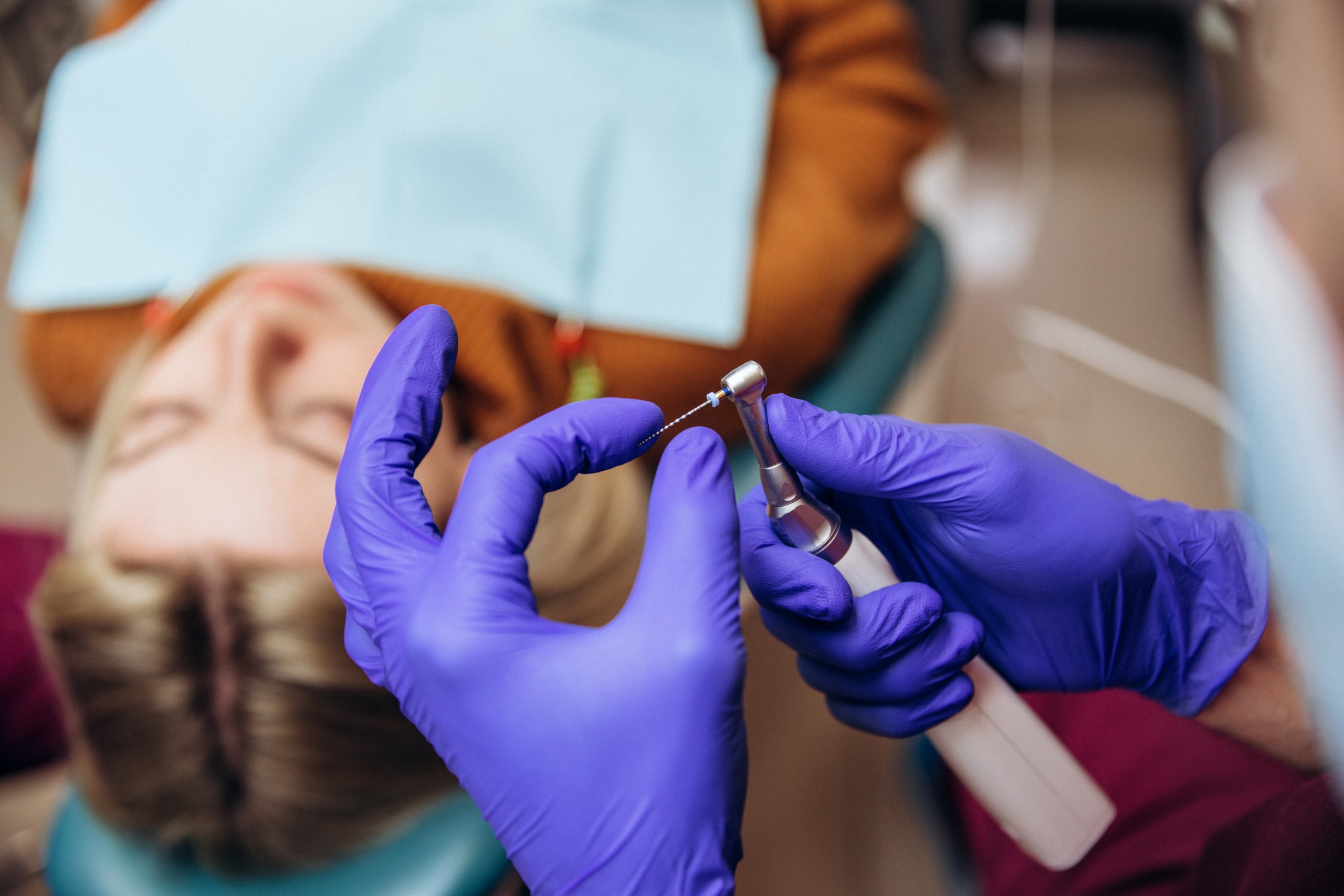Closeup of dental instruments, drill and needle, used for root canal treatment
